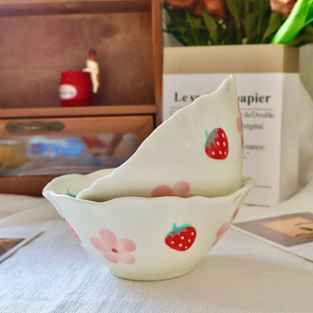 Decorative hand-painted ceramic bowl with wavy edge and tulip design