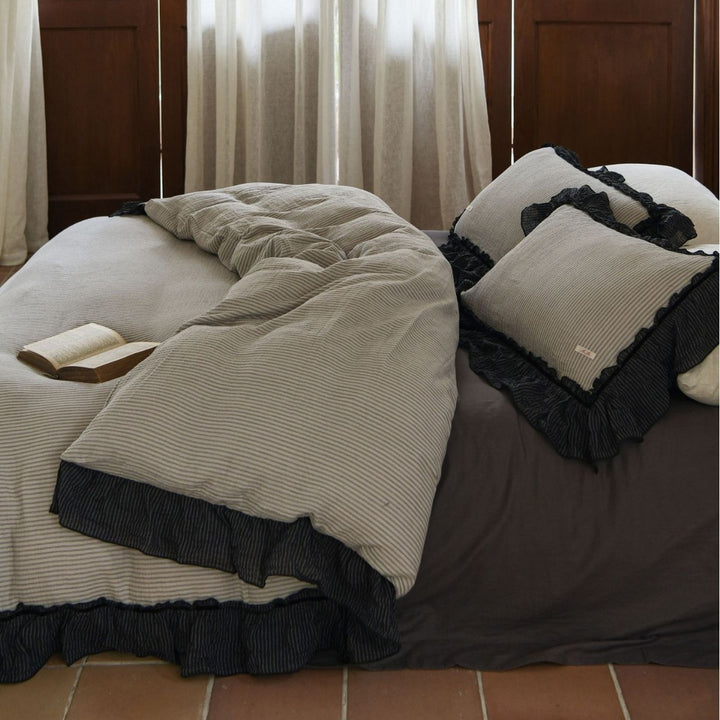 Luxurious bed linen set made of cotton gauze with quilted blanket and lace trim