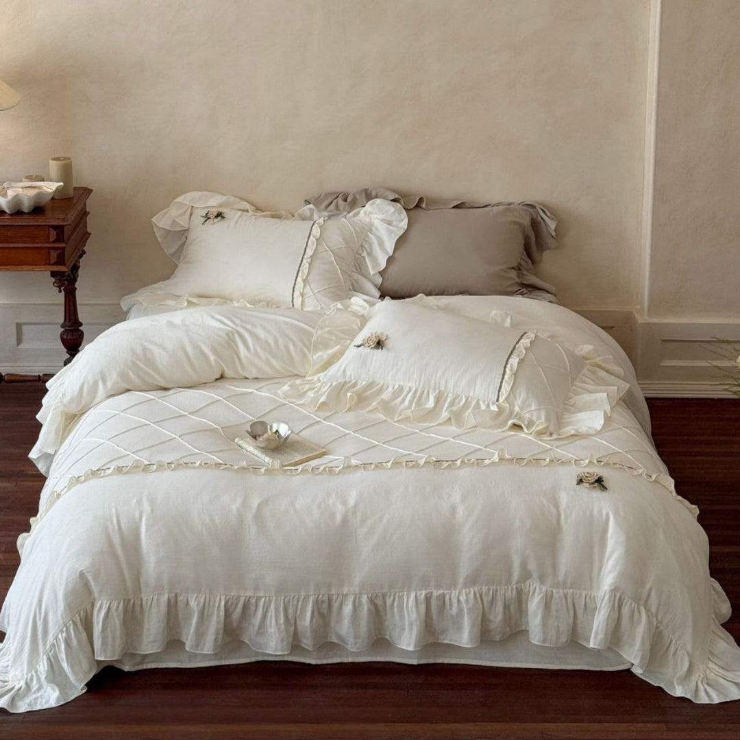 Country house style bedding set with quilted center piece, ruffle and rose appliqué