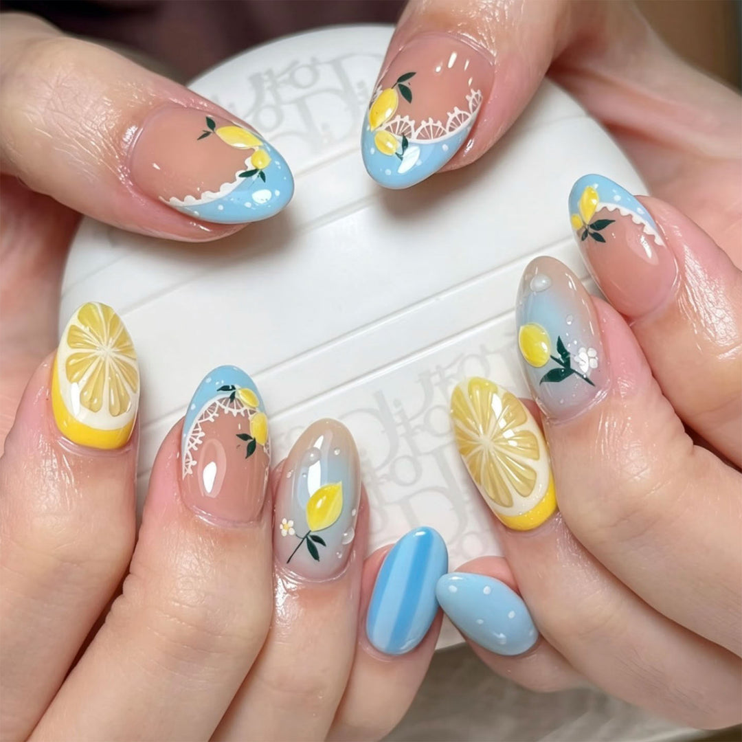 Artificial nail art with lemon and flower motifs Kalsten