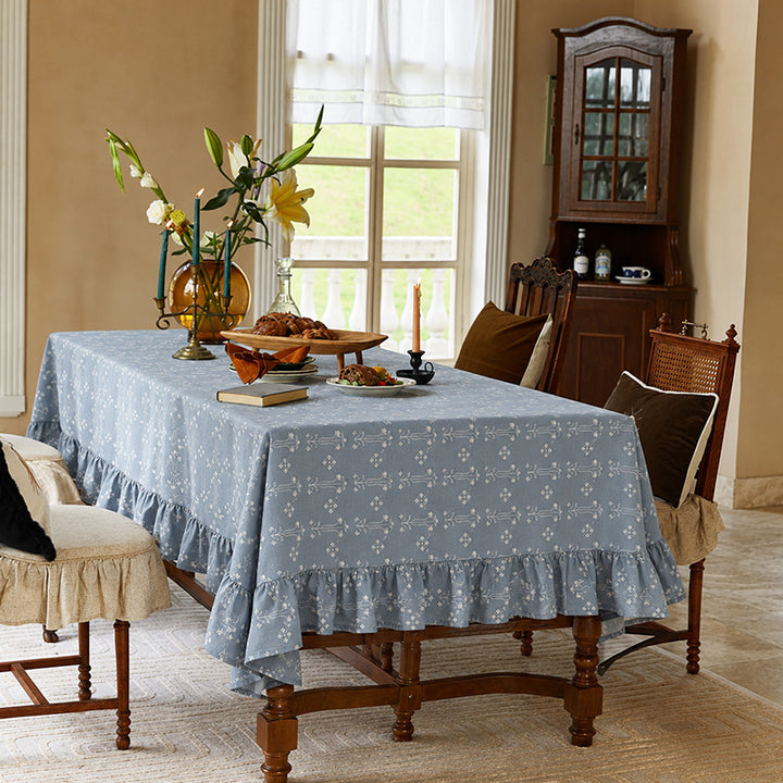 Rectangular tablecloth with ruffled border and delicate floral jacquard