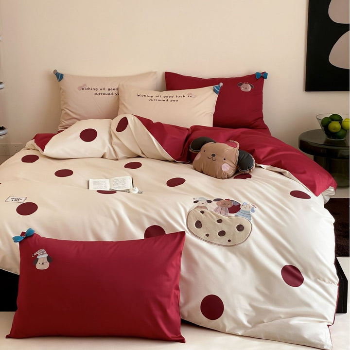 Children's bedding set with embroidered car applique and pompom detail