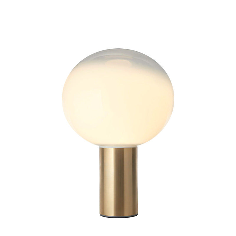 Modern Artistic Table Lamp with Sleek Metallic Base and Globe Shade