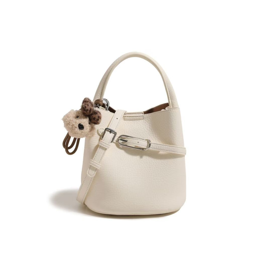 Chic Pebbled Leather Handbag with Cute Charm