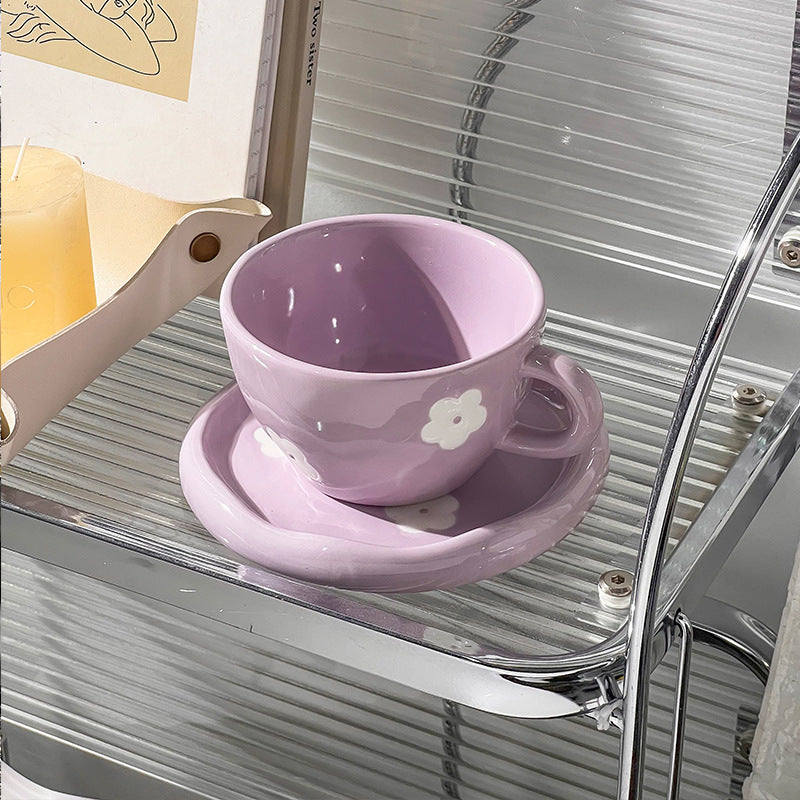 Large ceramic bowl as coffee and tea cup with matching saucer and decorative flower appliqués