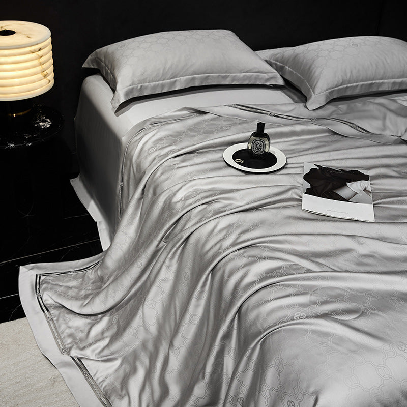 Luxurious quilted bedspread with satin jacquard and decorative border