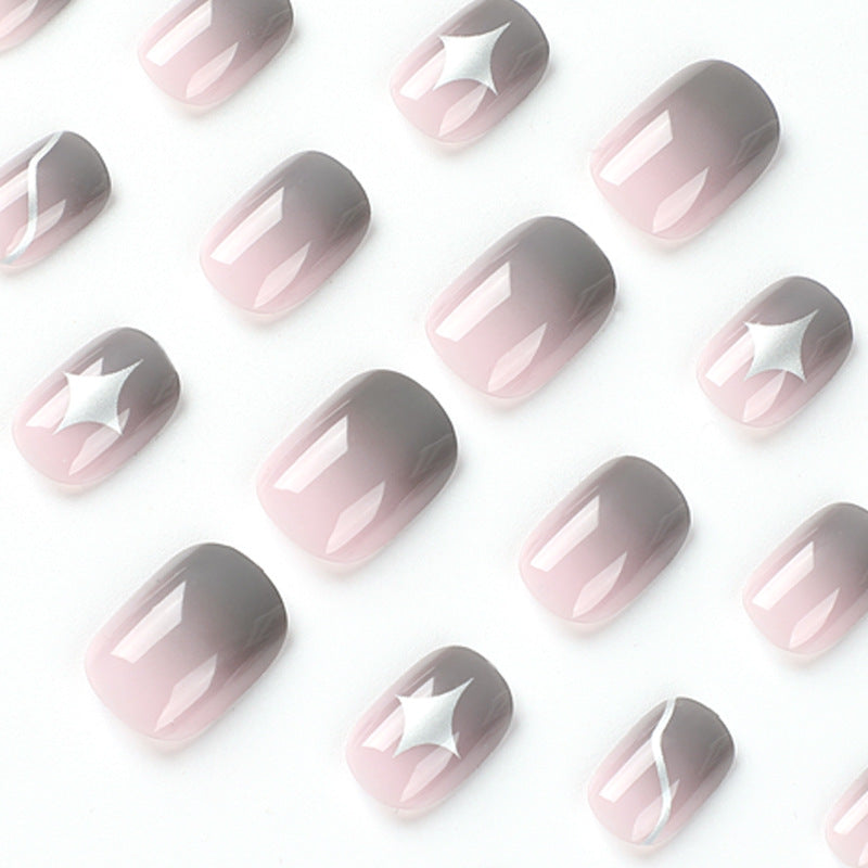 Artificial nail art with elegant ombre design and charming accents Kalsten