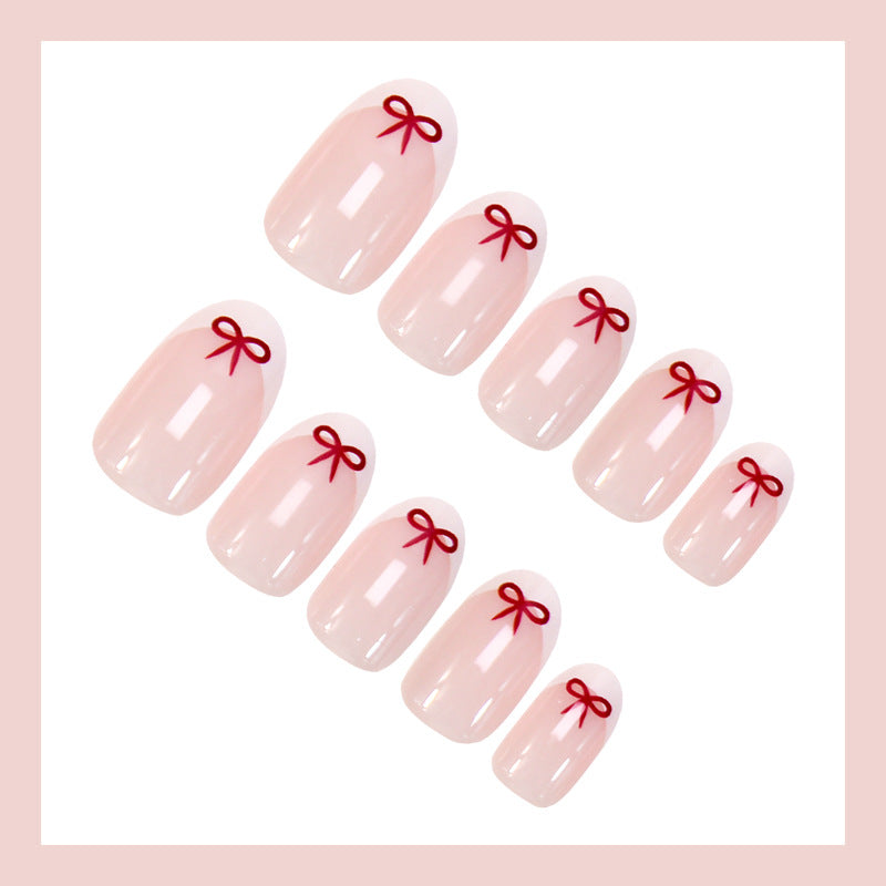 Artificial nail set with romantic bow motifs and French design Kalsten