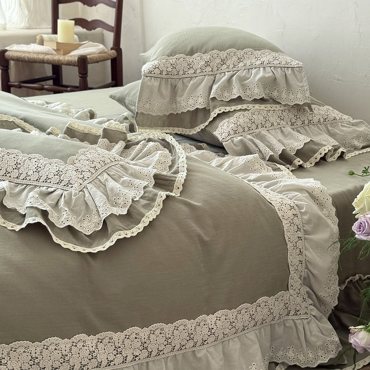 Romantic bedding set in country house style with ruffles and lace trim