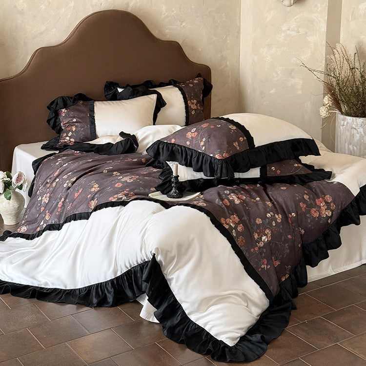 Reversible cotton satin bedding set with floral design and decorative ruffle trim