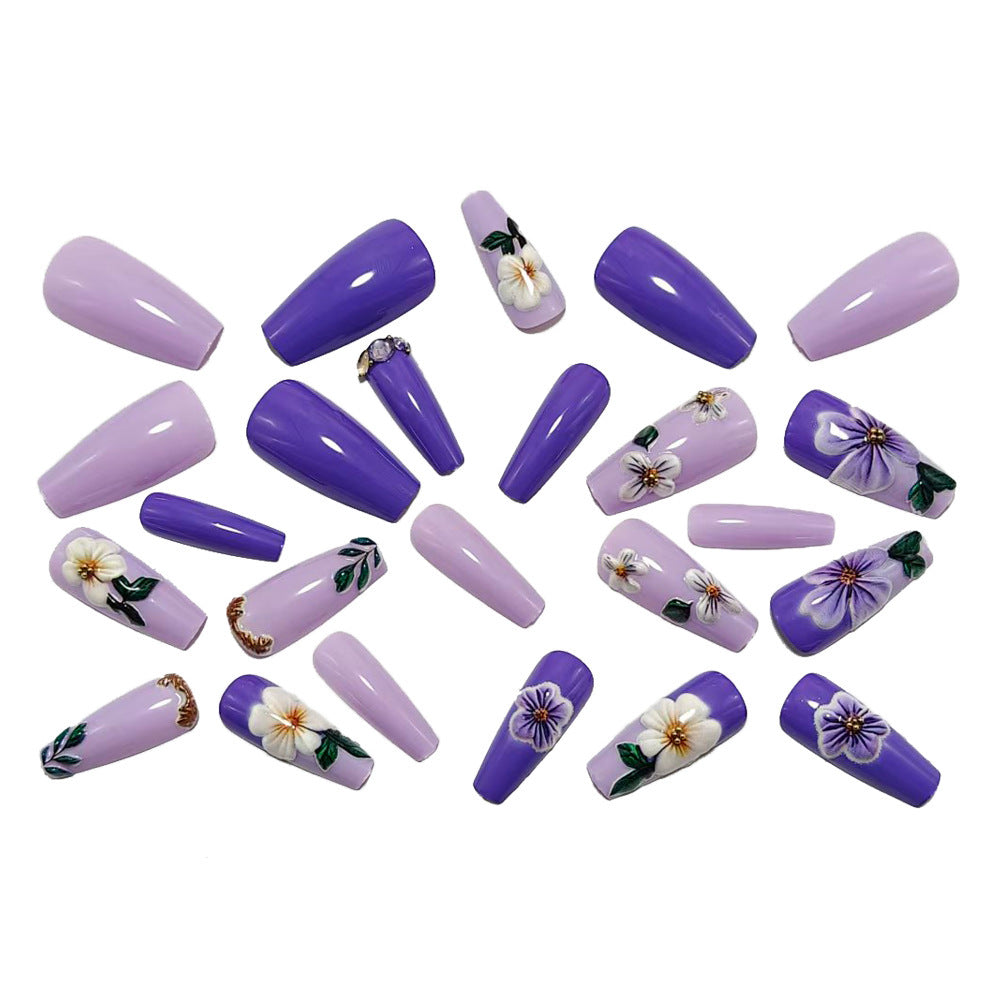 Artificial nails with floral embellishments and elegant high gloss Kalsten