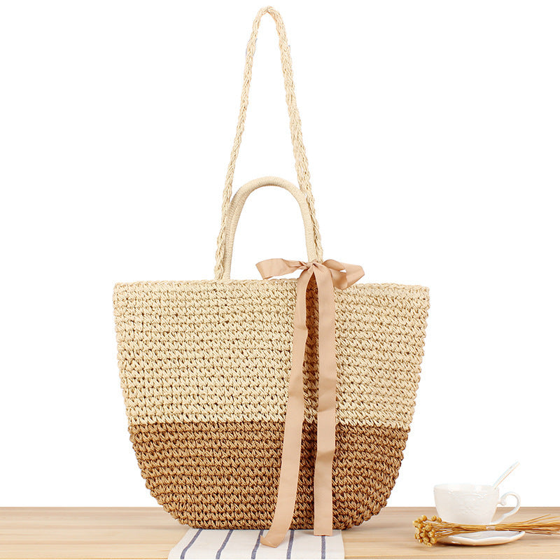 Beach bag made of natural raffia with playful design and elegant bow decoration Kalsten