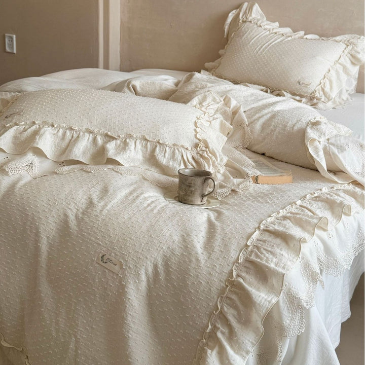 Bedding set in Shabby Chic with textured polka dot look, multi-layered ruffle, and lace finish