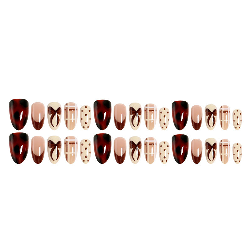 Artificial nail set with elegant bow and caramel designs Kalsten