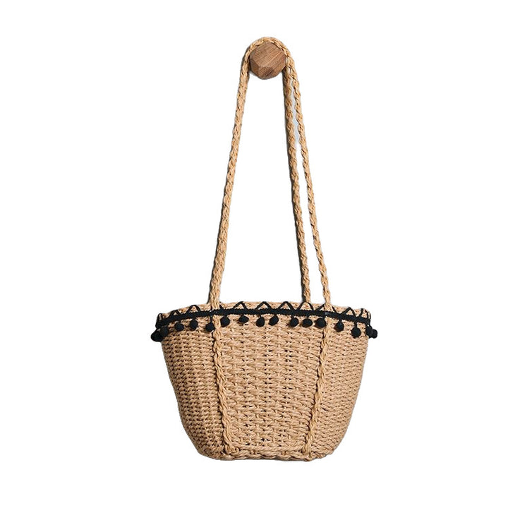 Delicate beach bag with pompons Kalsten