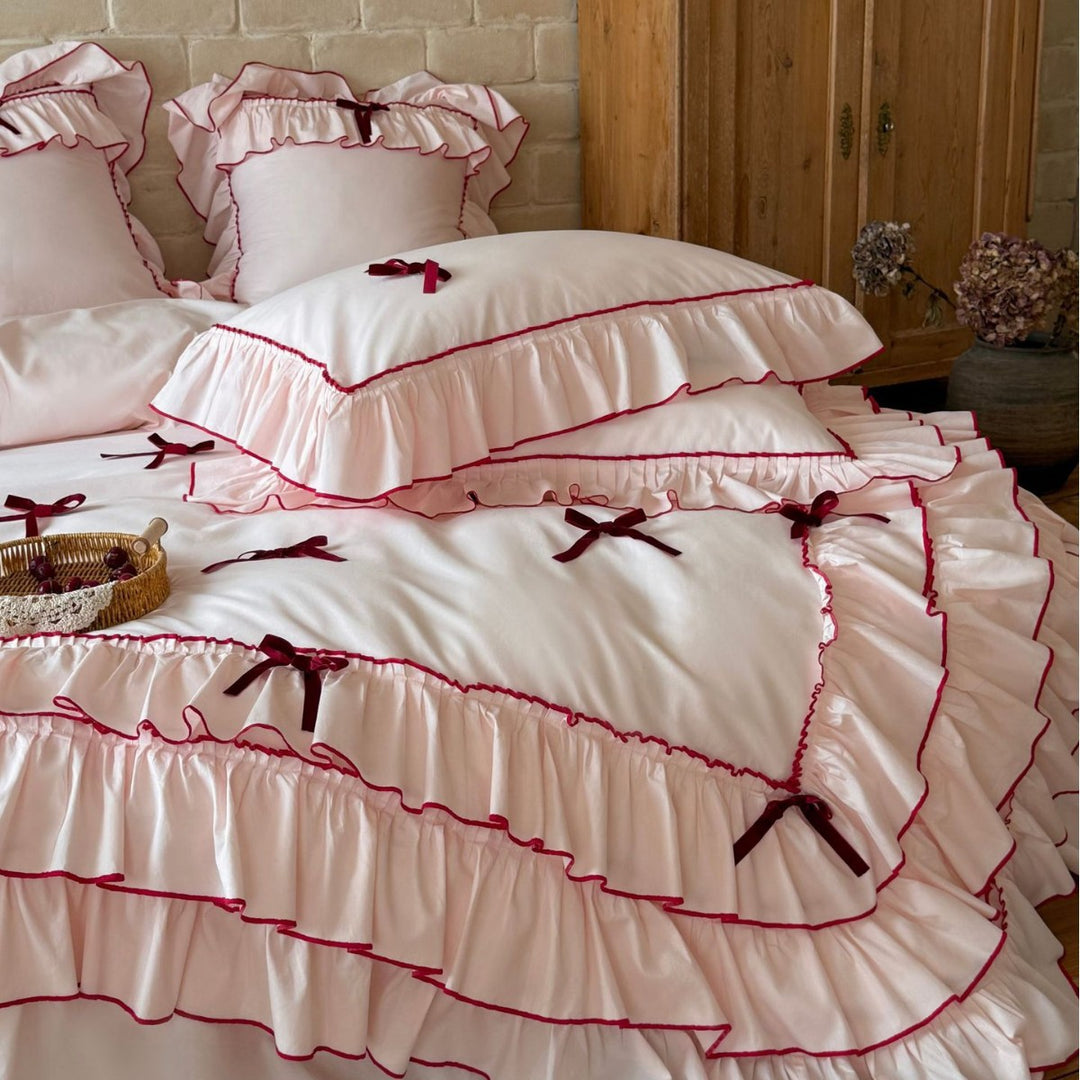 Romantic bedding set with ruffles, frills, and decorative bows