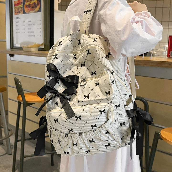 Playful backpack with bow details and practical compartments Kalsten