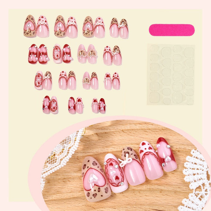 Artificial nail set with romantic heart designs and glamorous 3D details Kalsten