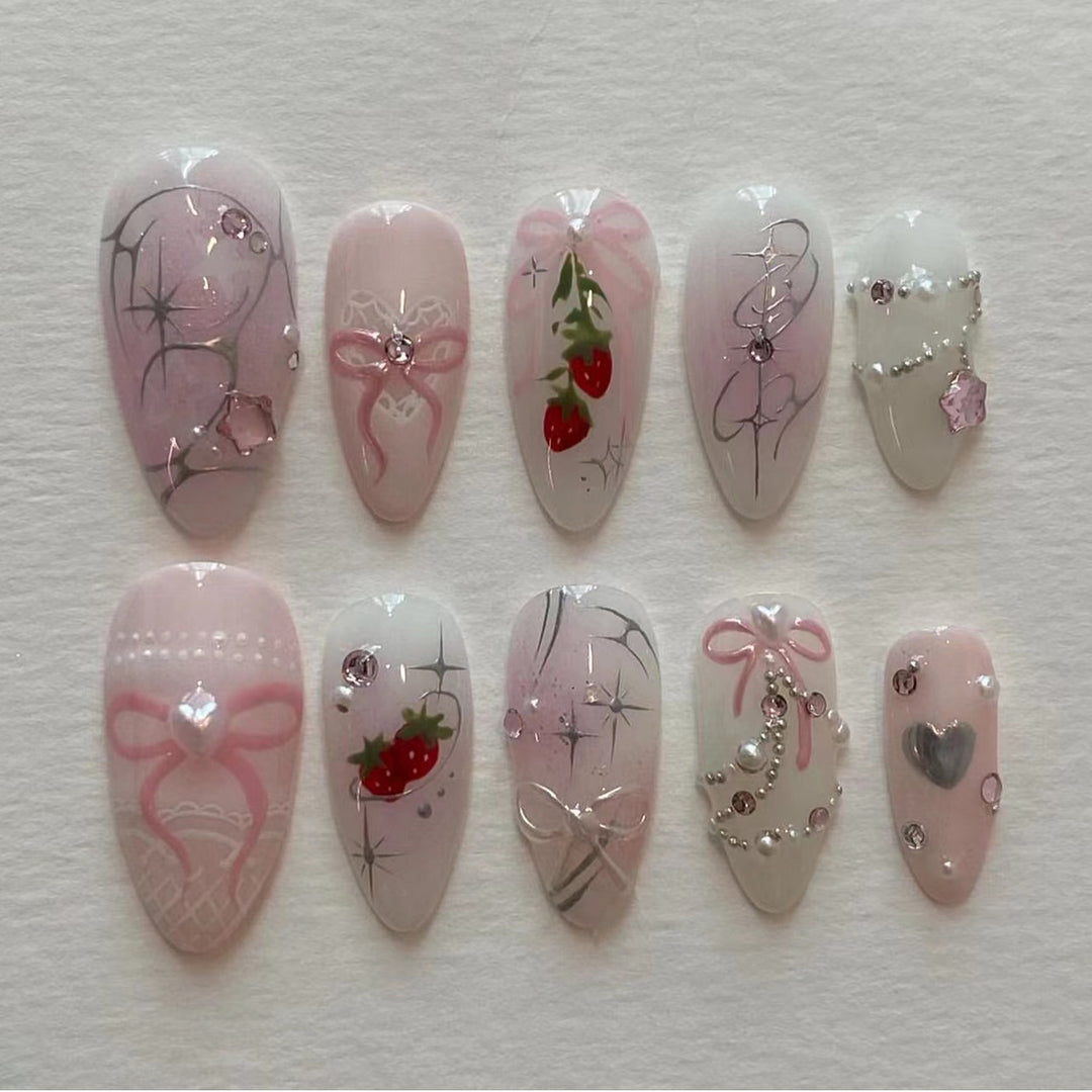 Artificial nail art with romantic design and glitter accents Kalsten