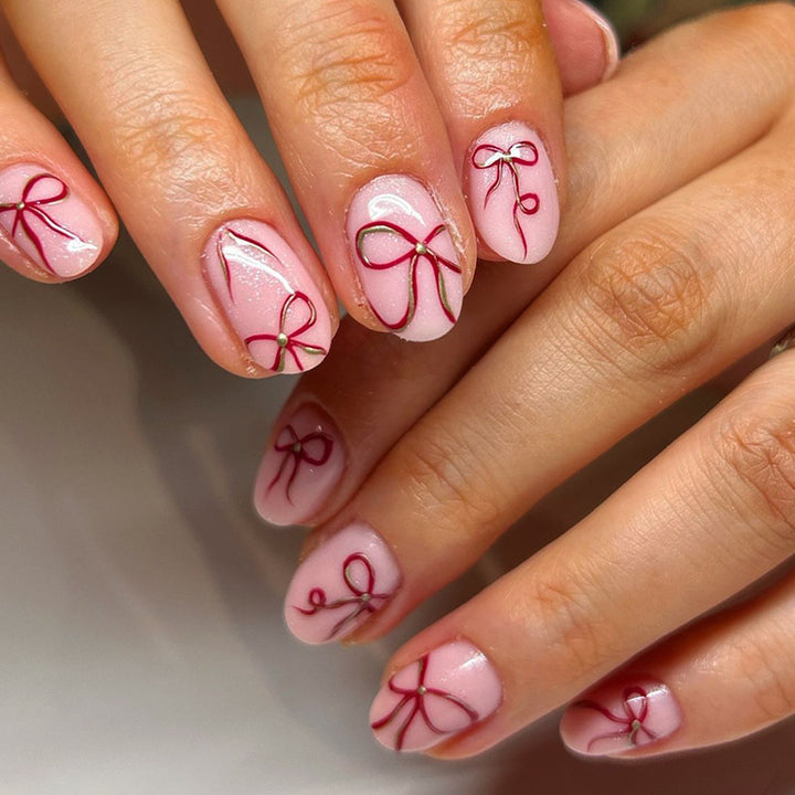 Artificial nail design with bow motifs Kalsten