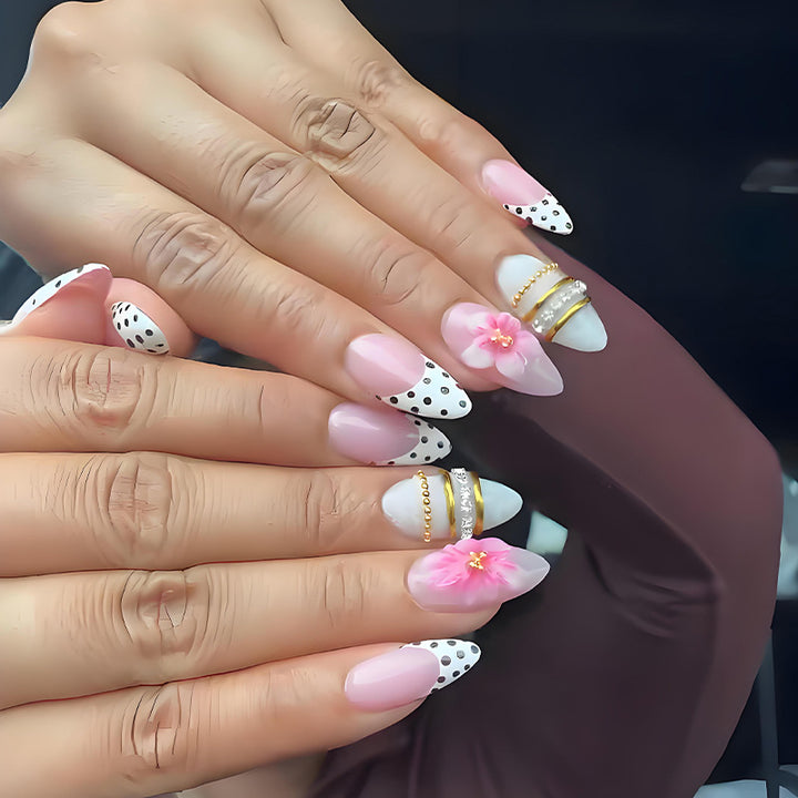Acrylic nail set with romantic floral patterns and elegant glitter decorations Kalsten