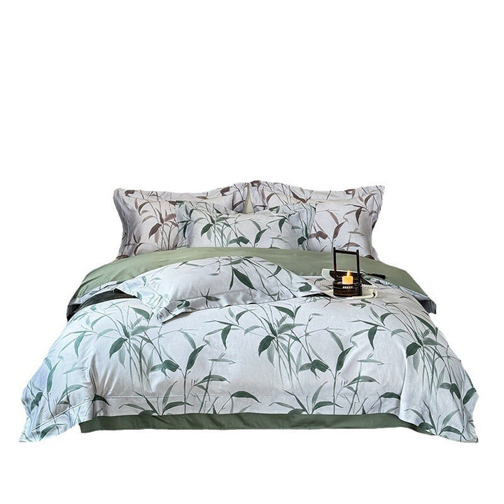 Bedding set made of cotton satin with botanical bamboo leaf print and reversible pillowcases