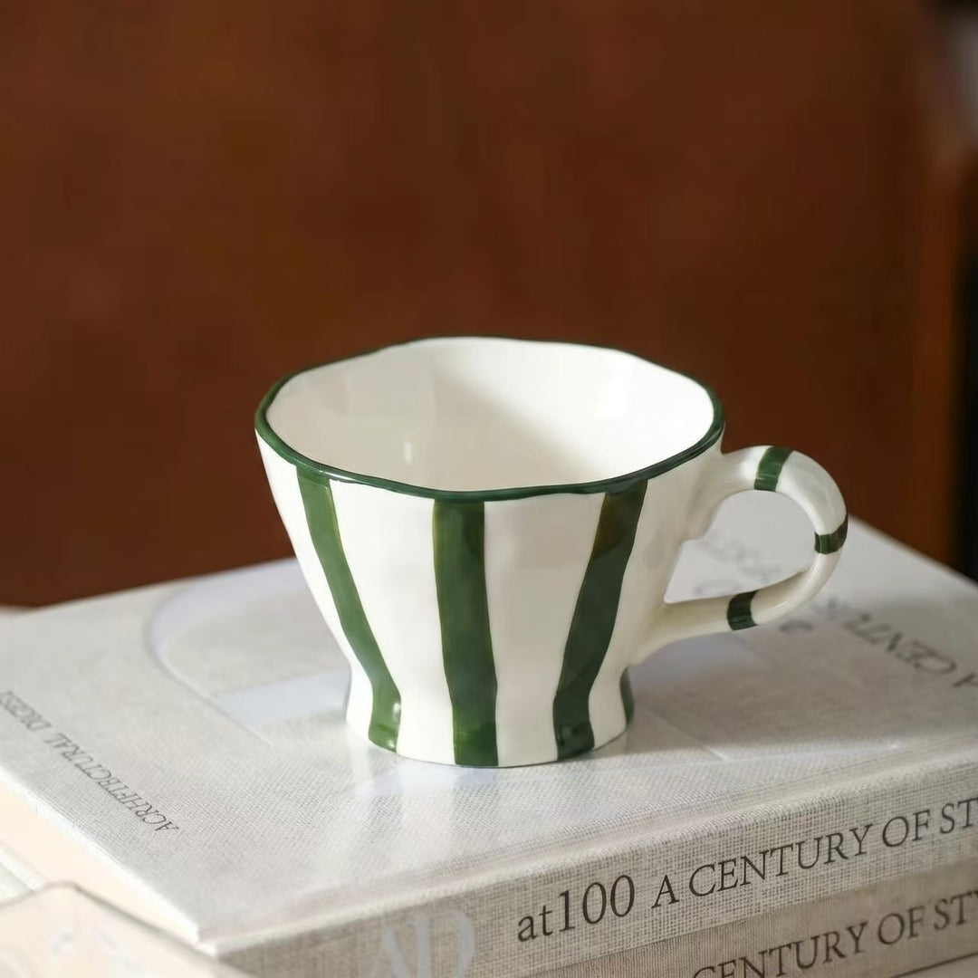 Designer stoneware coffee mug with scalloped rim and vertical brushstroke