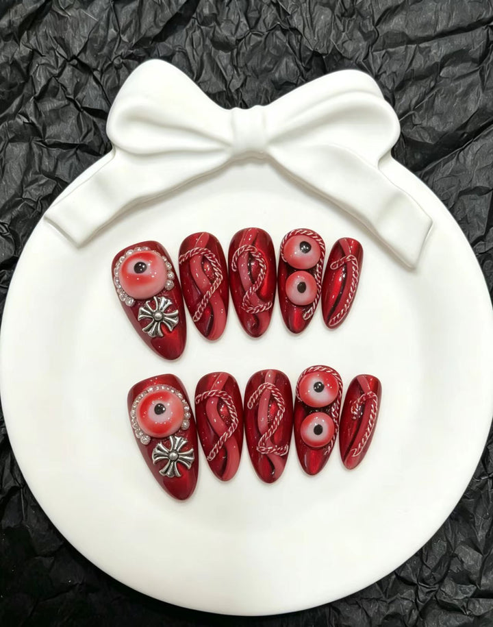 Artistic Press-On Nail Art Set with Unique Red Designs
