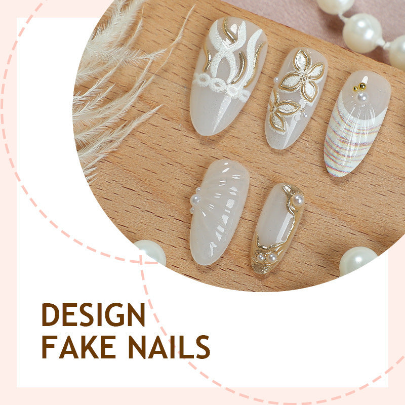 Artificial nail set with luxurious gold embellishments and elegant natural motifs Kalsten
