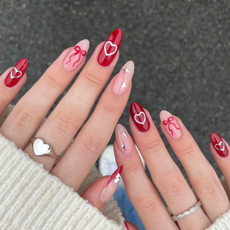 Artificial nail set with romantic hearts and bows Kalsten