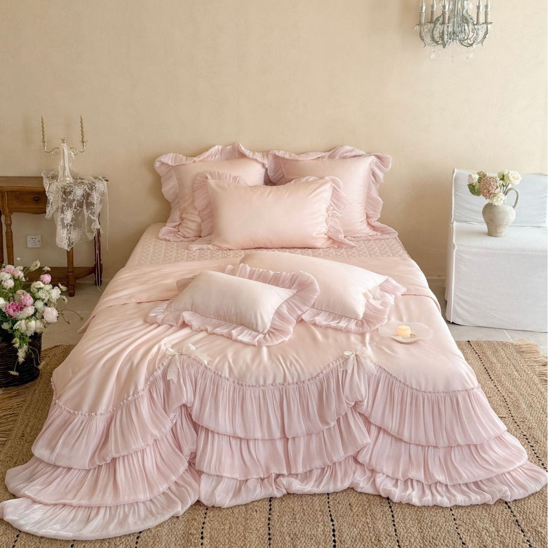 Romantic satin bedding and bedspread set with decorative ruffles and bows