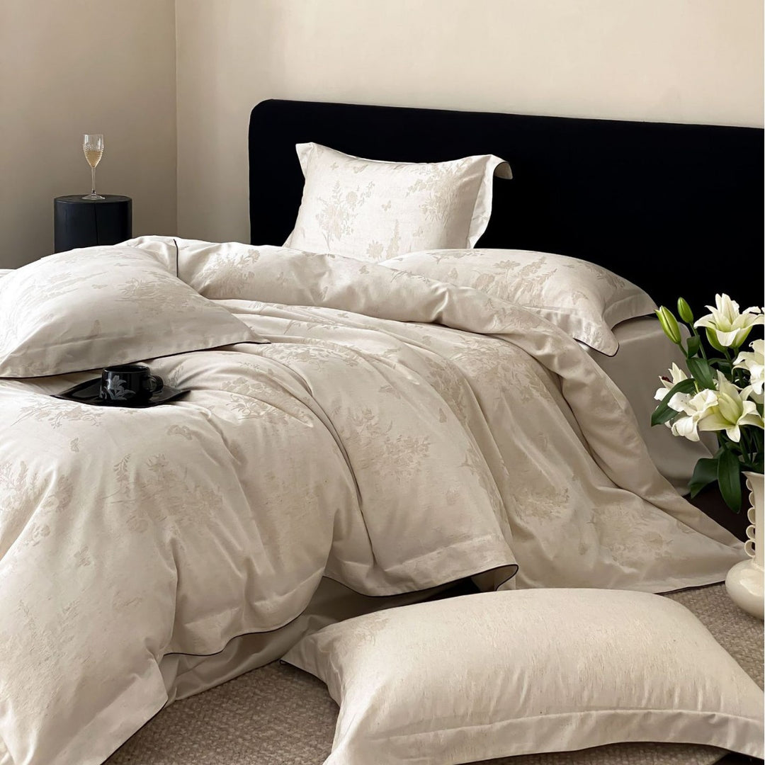 Finely woven cotton percale bedding set with subtle jacquard structure and contrast piping