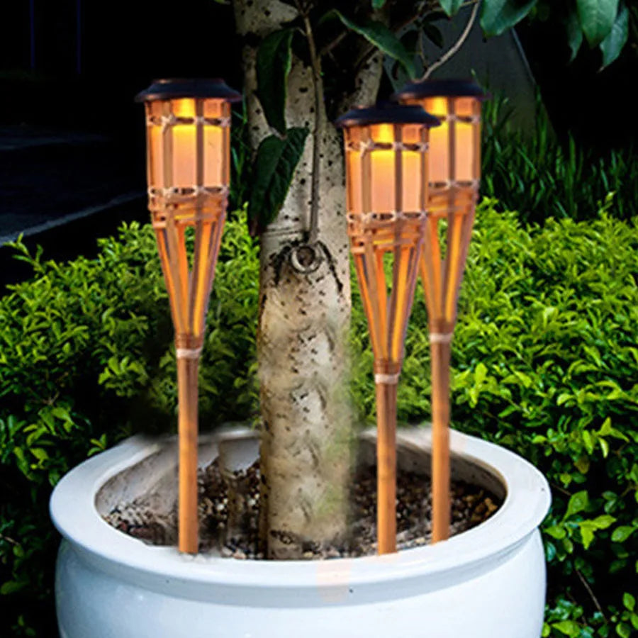 Solar-powered garden torches in bamboo design – Weatherproof LED decorative lighting for outdoors | Kalsten