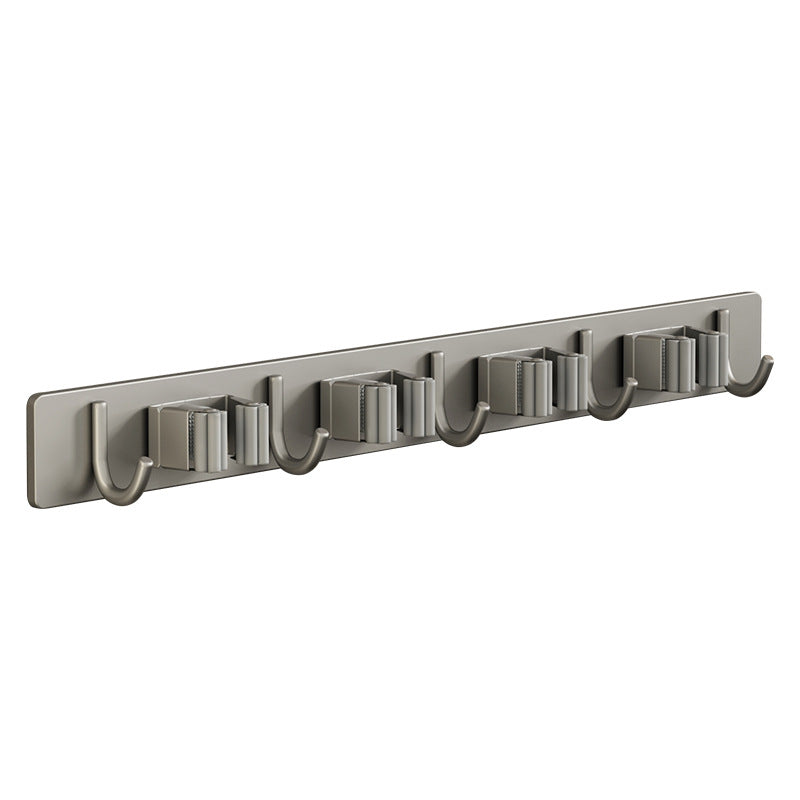 Wall bracket for brooms and mops made of stainless steel