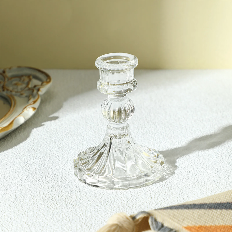 Transparent glass candle holder with structured pattern