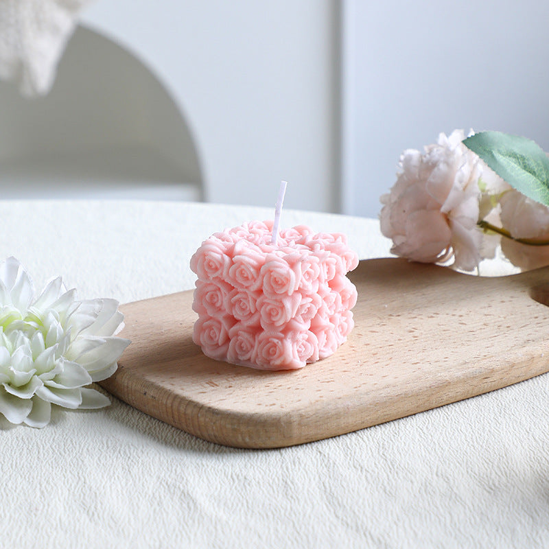 Rose-colored scented candle made from soy wax, handcrafted