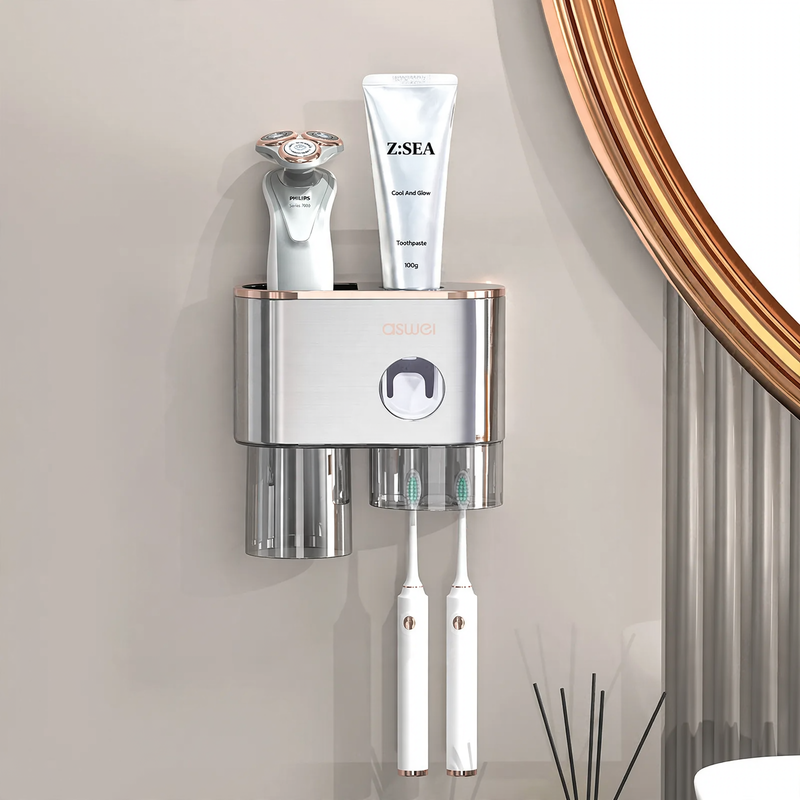 Toothbrush wall holder with toothpaste squeezer