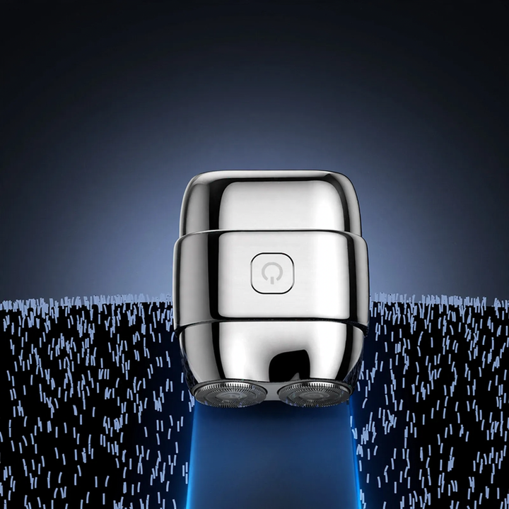 Portable electric razor with double blade ring