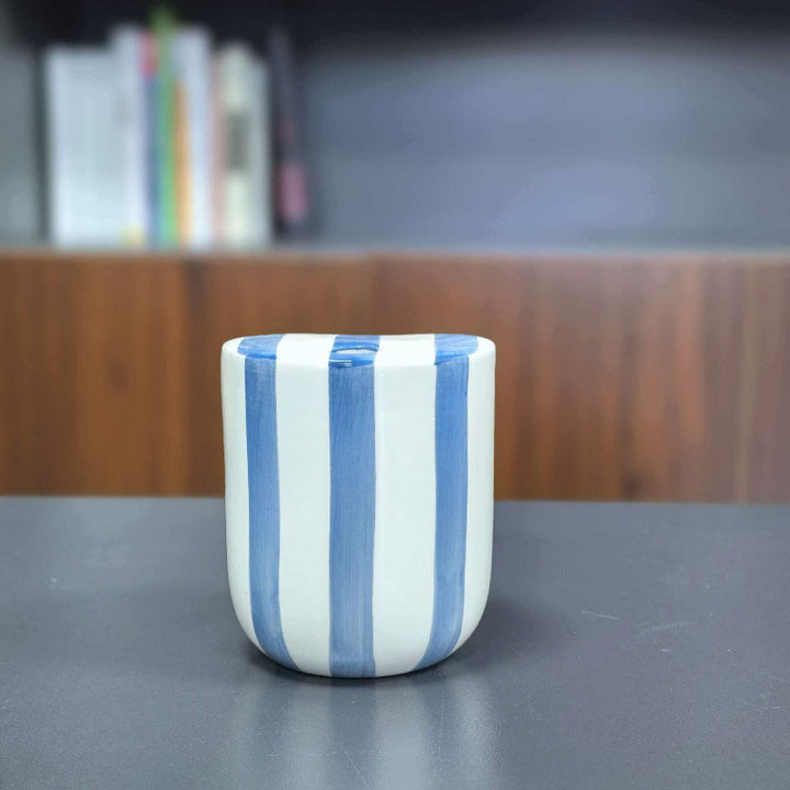Ceramic coffee mug with hand-painted stripes
