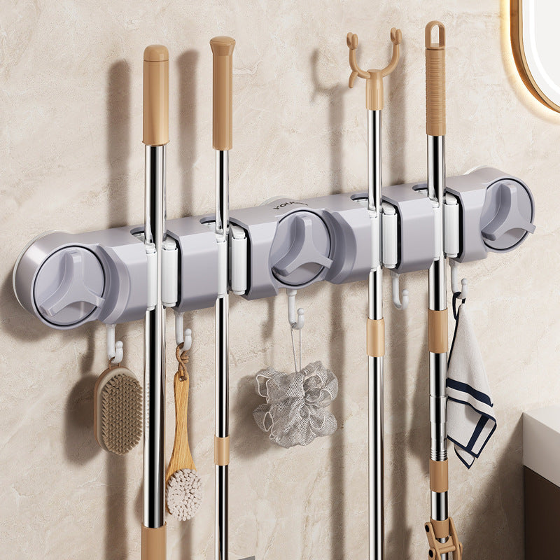 Suction cup holder for broom and mop