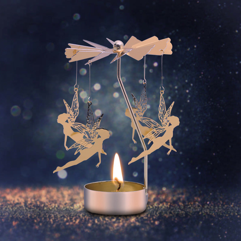 Rotating metal candle holder with scented candle