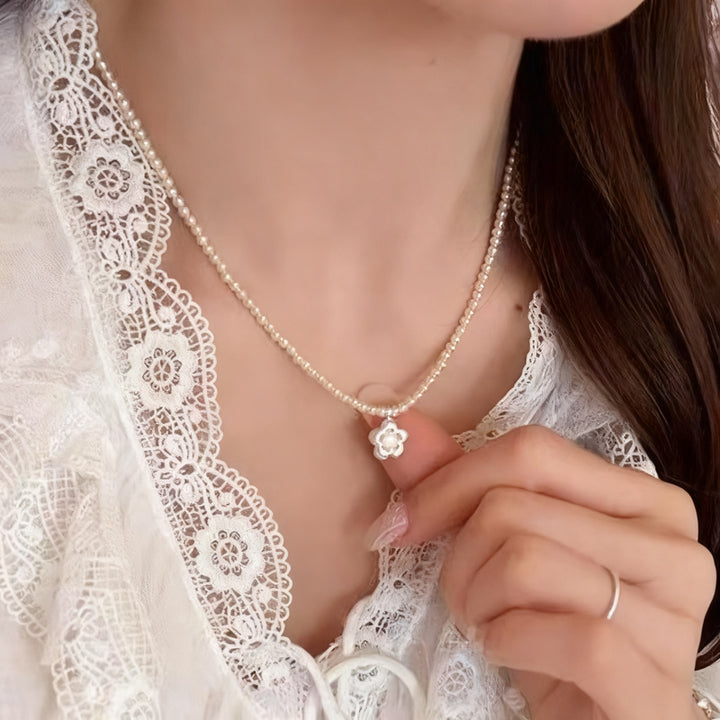 Pearl necklace with silver clasp, pearls 4–12 mm