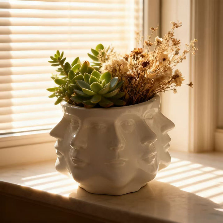 Modern flower pot with geometric face pattern