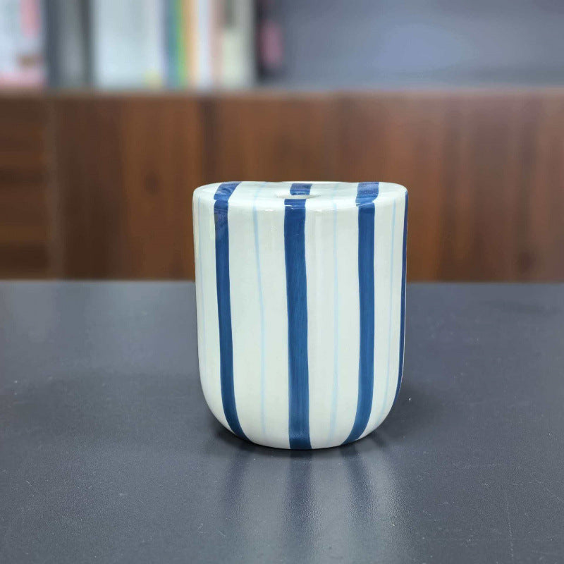 Ceramic coffee mug with stripes and heart design