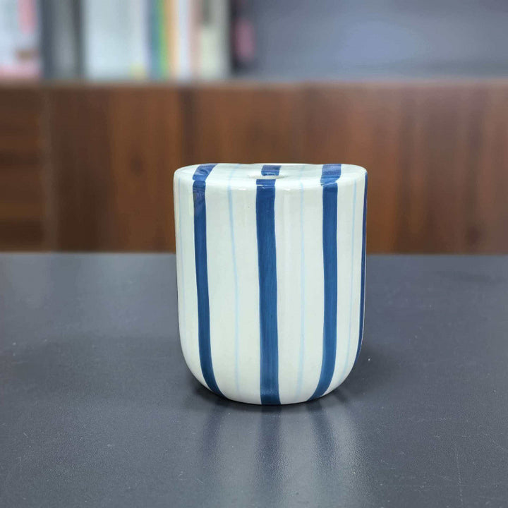 Ceramic coffee mug with stripes and heart design