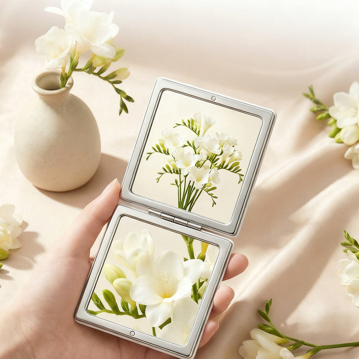 Folding cosmetic mirror, double-sided