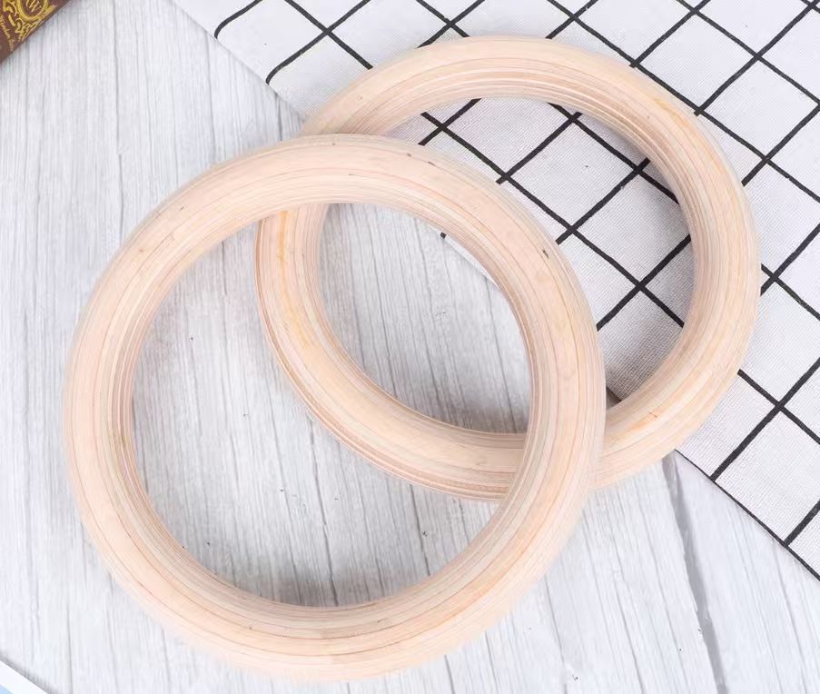 Wooden gymnastics rings with strap