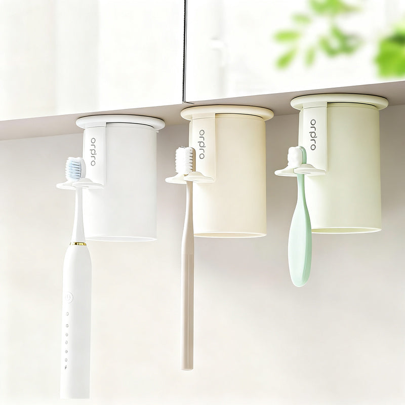 Magnetic toothbrush and rinse cup holder