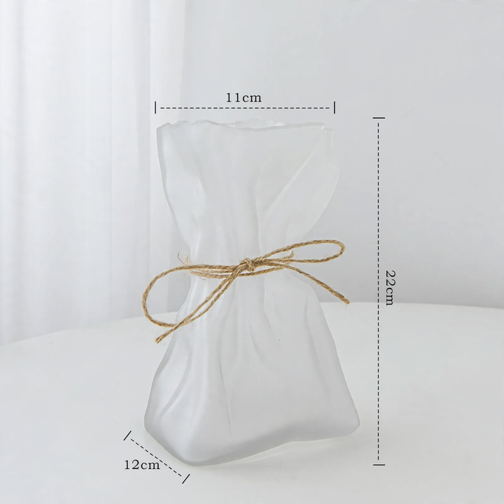 Glass vase with irregular folding pattern