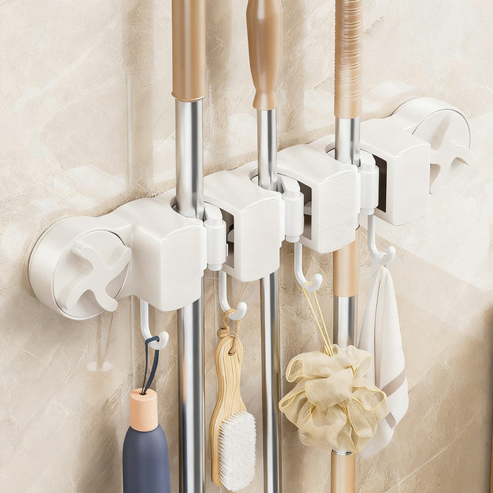 Suction cup holder for broom and mop
